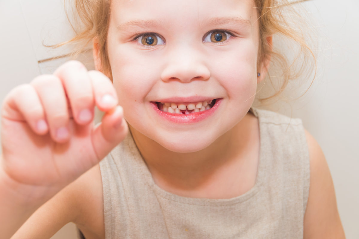 how to remove a baby tooth without pain